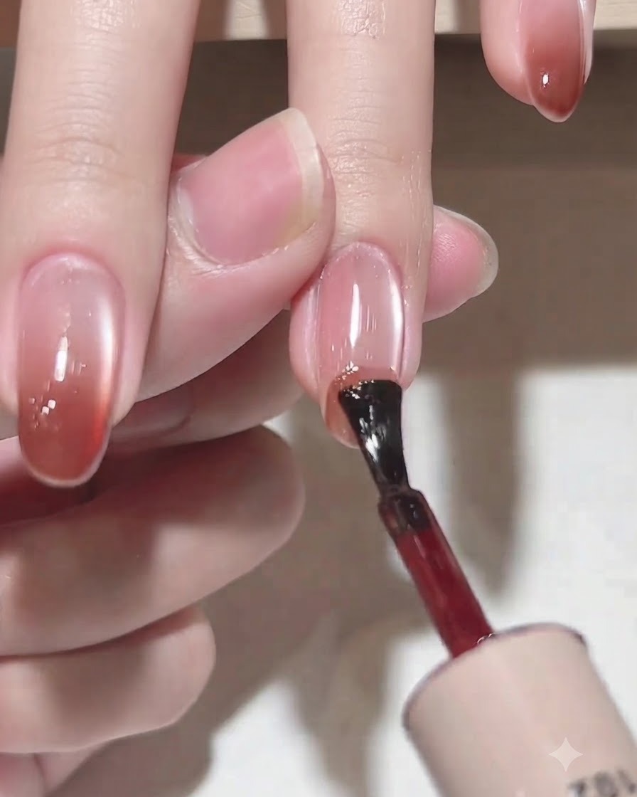 An applicator brush picking up color gel C102 from the bottle.