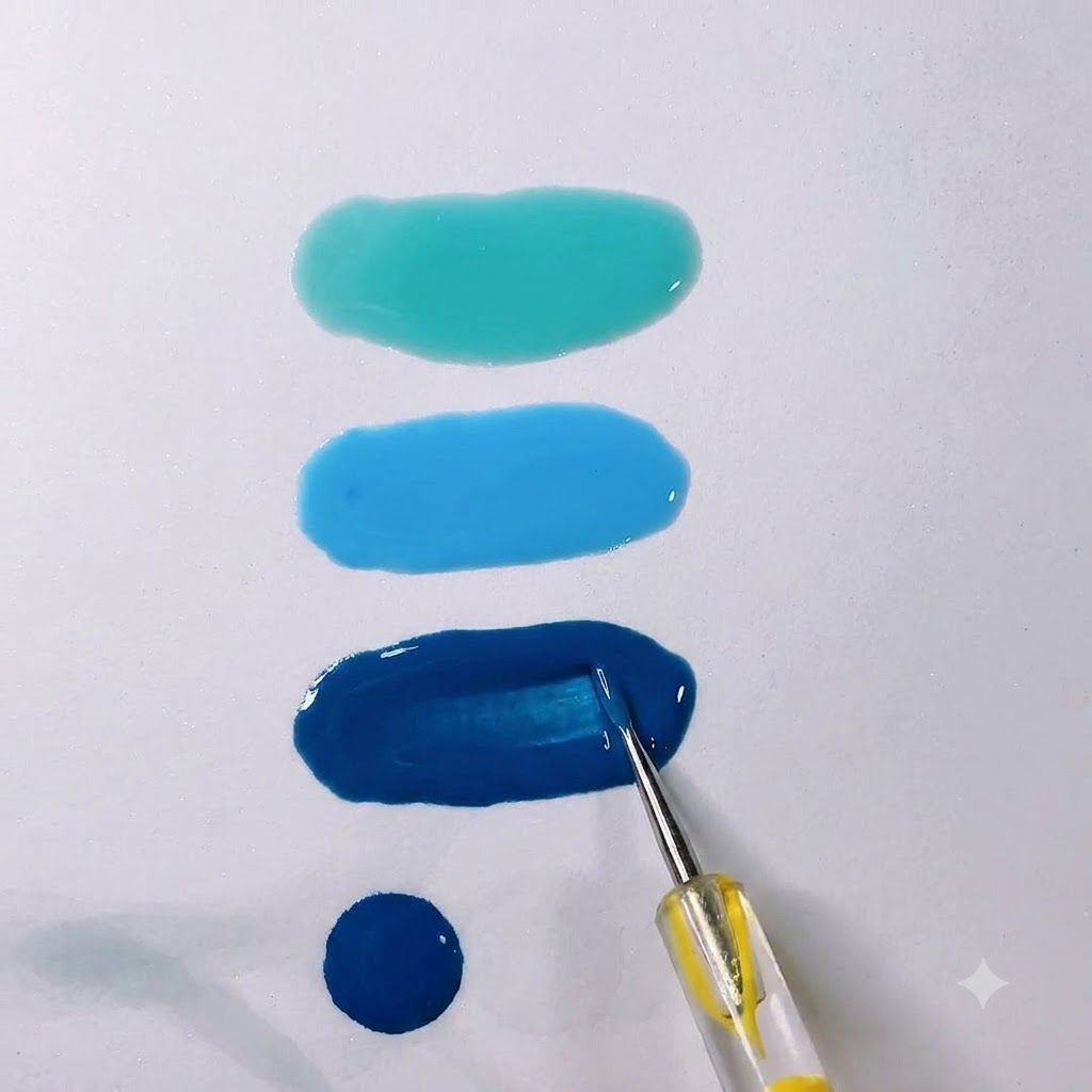 A smooth, oblong pool of translucent icy smoke grey gel on a white palette with a mixing tool.
