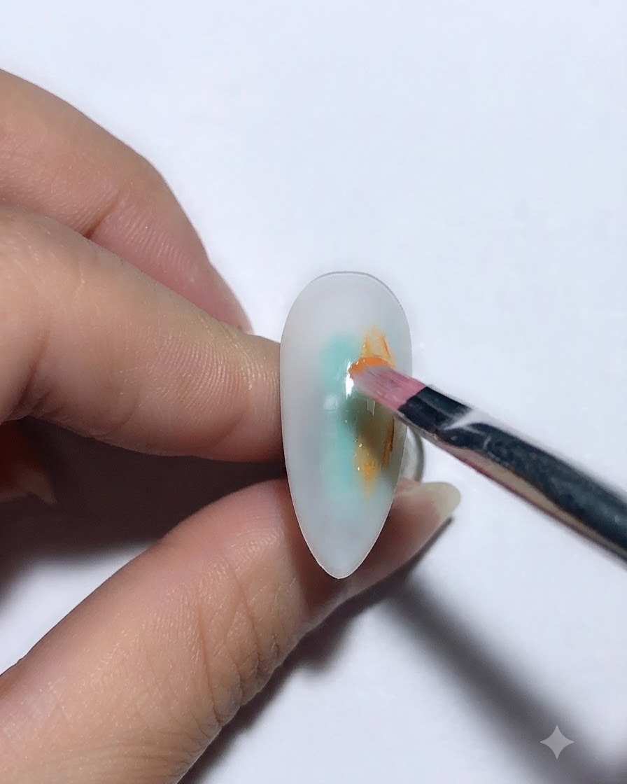 A close-up of a finger with a painted nail being placed under a UV LED nail lamp for curing.