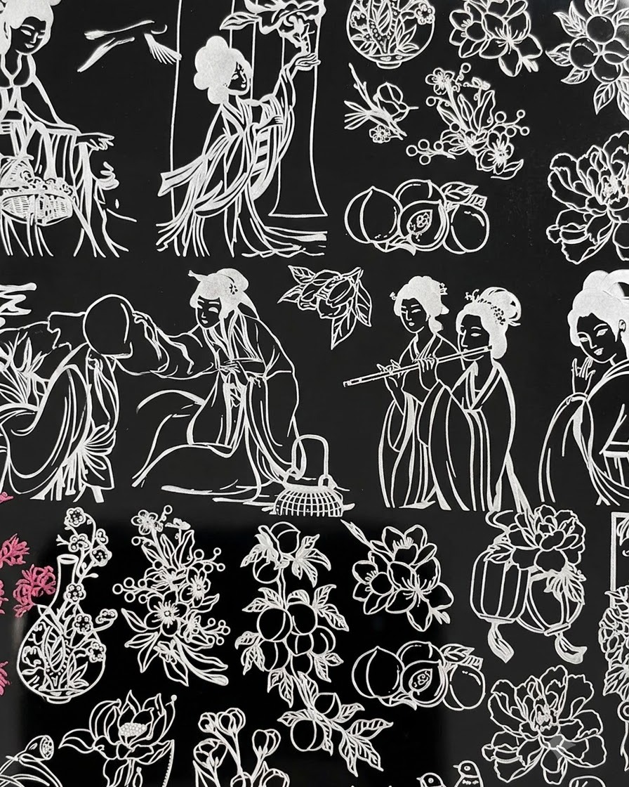 A stamping plate layout showing traditional female figures alongside floral arrangements, with pink color accents visible on the left side.
