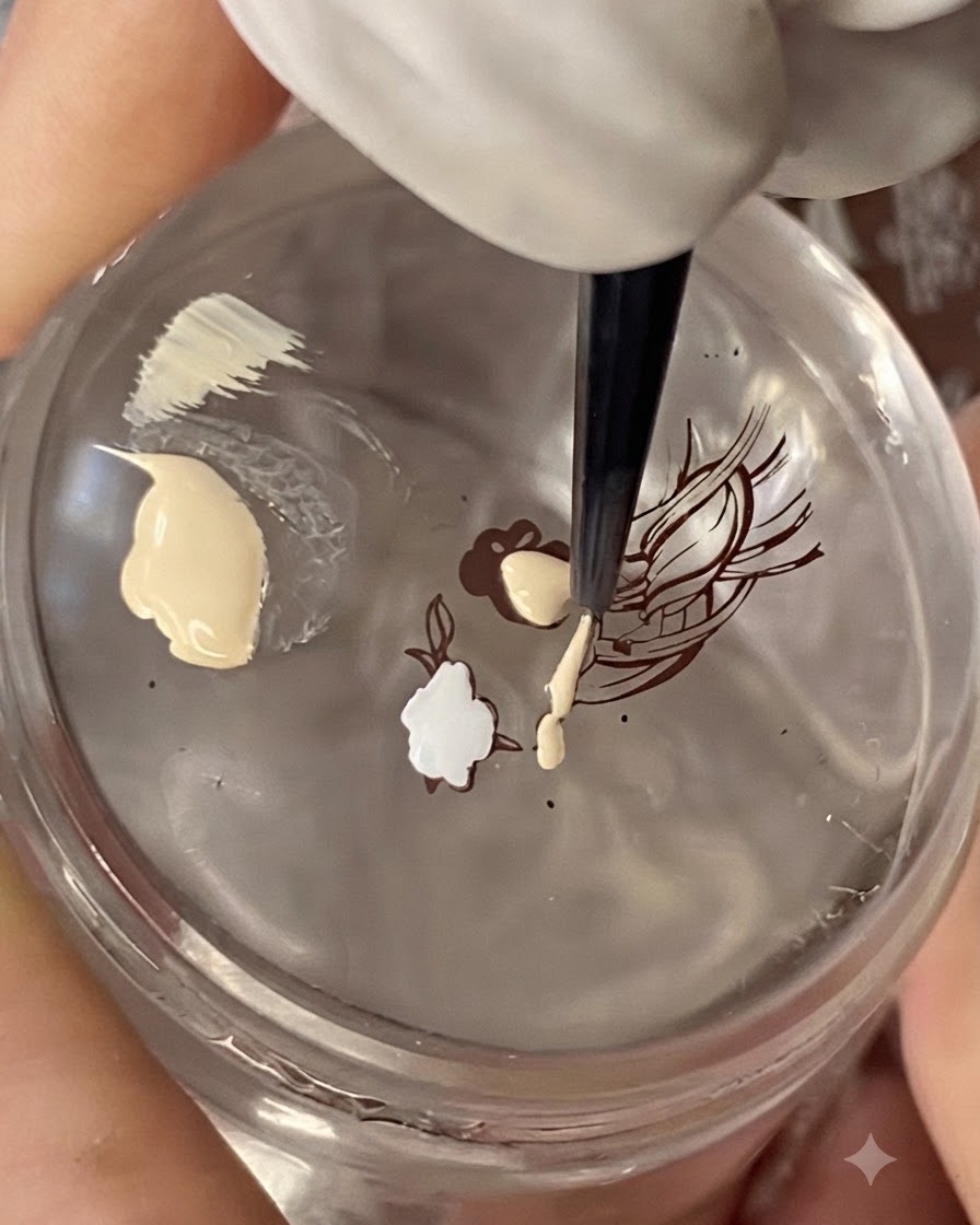 A clear stamper transferring a black line-art illustration of a traditional Chinese woman onto a nude nail tip.